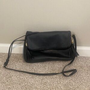 Elegant Black Crossbody Bag with Tassel Accents